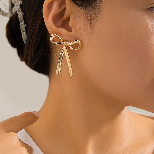Add a Touch of Elegance: Discover the Charm of AuricAdorn Glossy Ribbon Bow Earrings